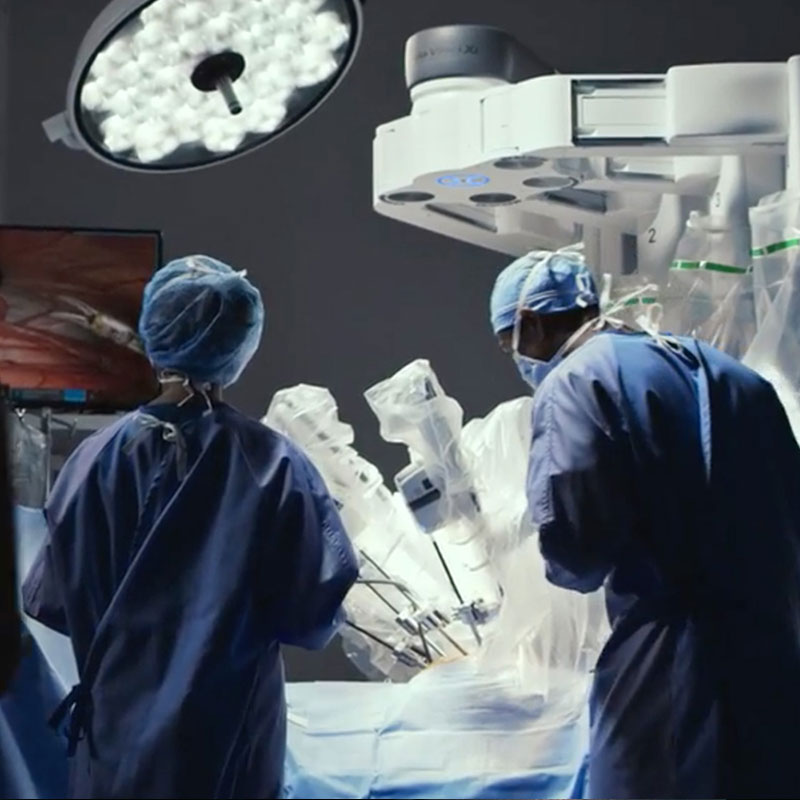 OR Staff with DaVinci Patient Cart